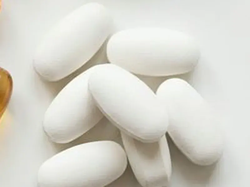 White supplement tablets